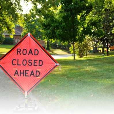 Image of a road closed ahead sign