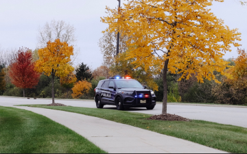 A police squad driving. 