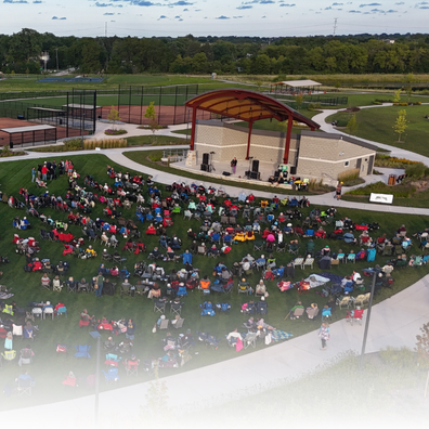 Aerial image of people sitting at a park. 