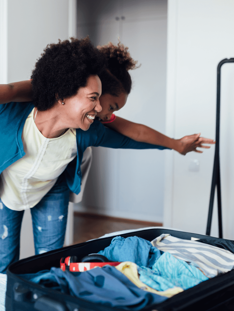 Mother-and-daughter-packing-a-suitcase